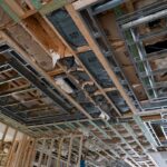 Exposed ceiling framing and structural systems during a luxury home renovation in Miromar Lakes, Florida