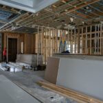 Wide view of open framing and exposed ceiling structure inside a luxury home renovation in Miromar Lakes, Florida